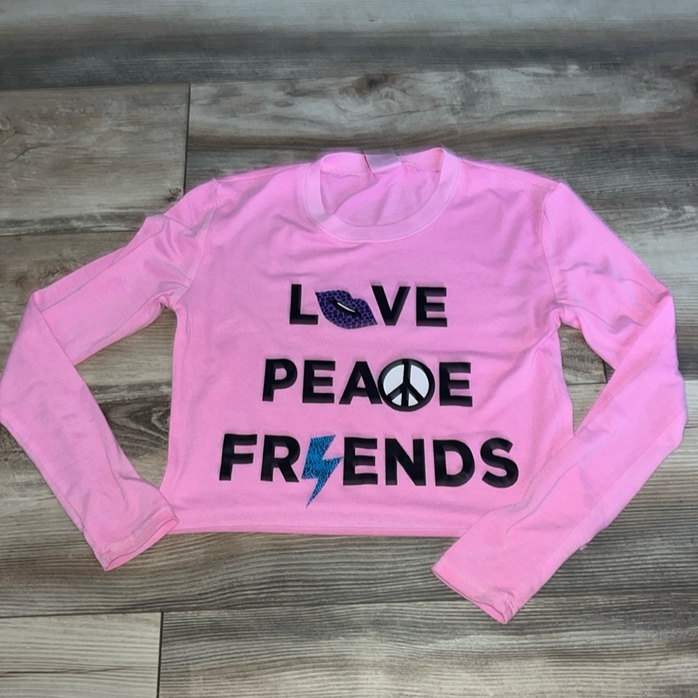 Girls light weight pink shirt w/ trendy design, medium 8/10